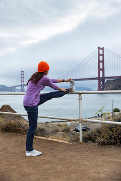 Asian Athlete stretch before running city