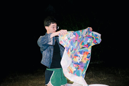 Vibrant Shirt Unveiling at Night Gathering 