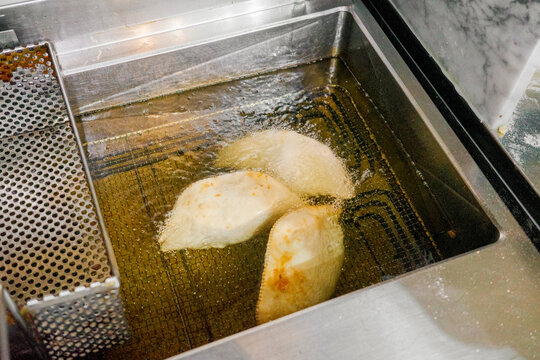 Cooking Delicious Panzerotti in Hot Oil 