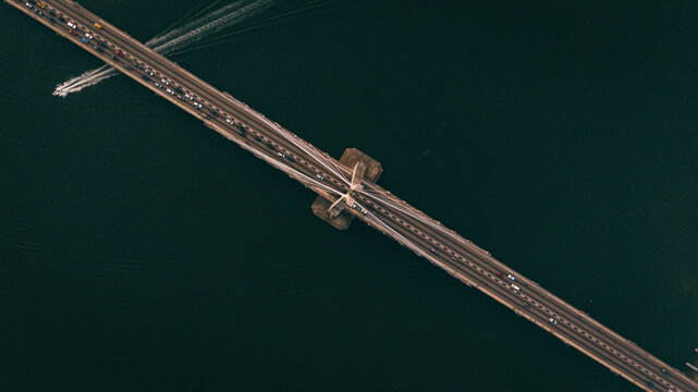 Aerial view of Lekki-Ikoyi Link Bridge cutting across the dark water, a stark contrast to the grey concrete, Lagos, Lagos, Nigeria.
