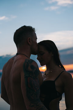 Romantic couple by lake at sunset in Torrevieja