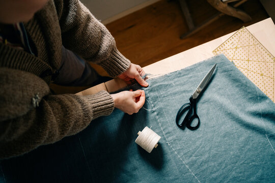 Sewing Lesson With Fabric and Scissors in a Cozy Workspace