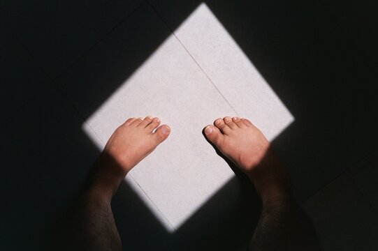 Feet in a square light 