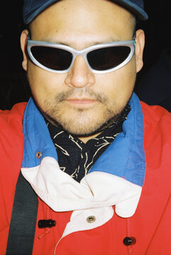Cool man with cool sunglasses and red jacket