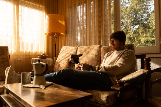 Man relaxing with dog