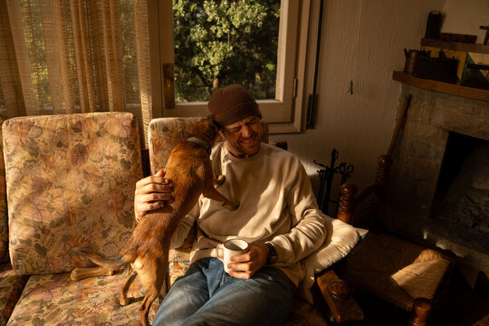Man playing with dog