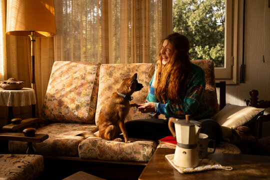 Woman playing with dog