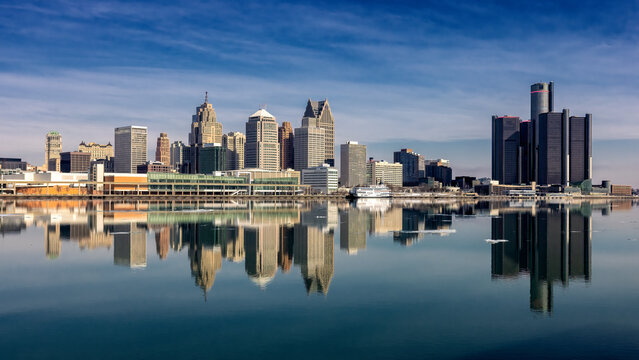 Reflective Afternoon View of Detroit Michigan with the city skyline reflecting