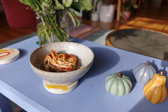 Colorful Table Setting With Ceramic Decorations and Food