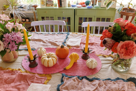 Colorful Fall Table Setting With Pumpkins and Flowers for Gathering