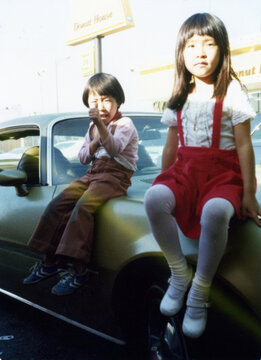 Kids Sitting on Classic Car Hood, 1970s Sunlight