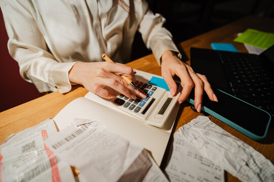 Woman uses a calculator