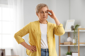 Mature woman experiencing menopause at home