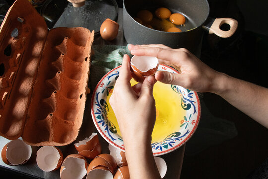 Cracking Eggs in a Kitchen, Preparing for a Meal at Home