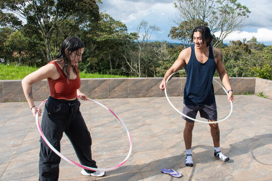 Hula Hooping in a Scenic Outdoor Setting With Friends