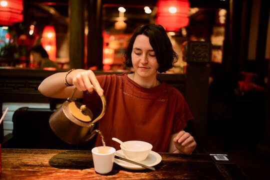 Tea is Being Served in a Cozy Setting at an Oriental Restaurant