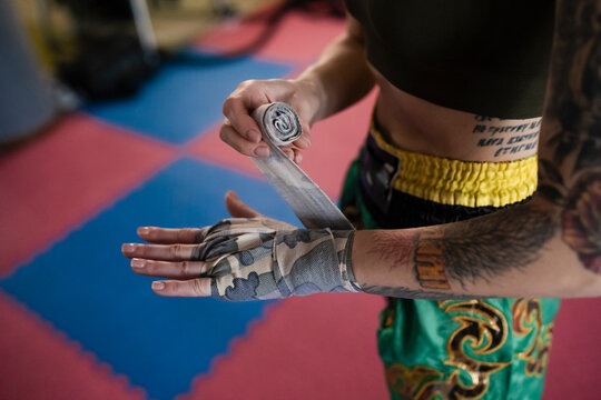 Close-Up of Athlete Wrapping Hands Before Training