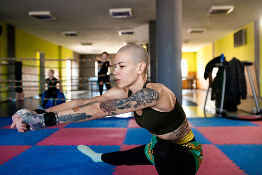 Joyful Athlete Stretching Before Training