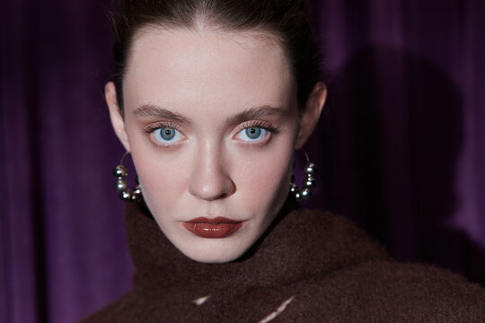 Closeup beauty portrait of woman looking at camera