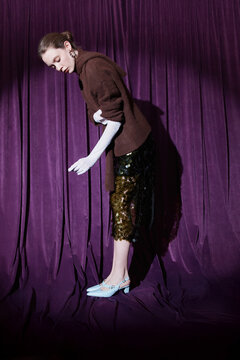 Studio fashion portrait of woman in evening style clothes