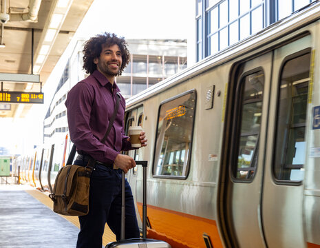 Man smile confident wait for train at station 