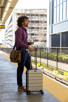 Man confident wait for train at station 