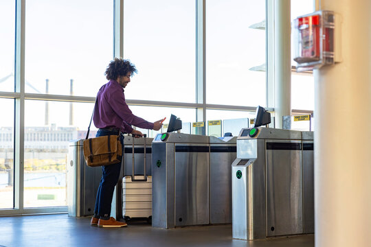 Black Commuter use mobile phone pay subway 