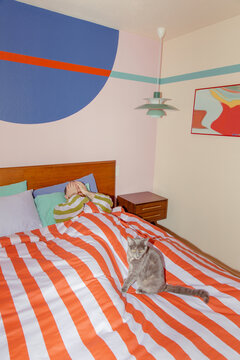 Man and cat in bed