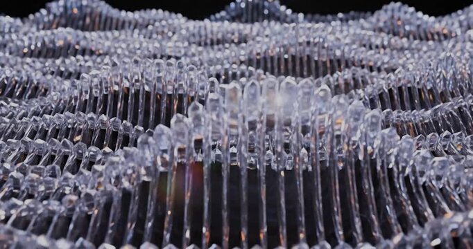 Rows of Clear Plastic Forks Close-up View.