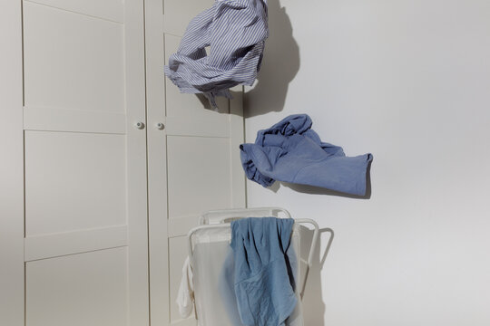 A laundry basket where clothes are thrown