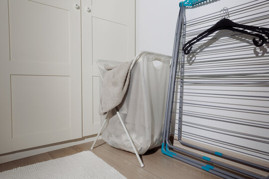 A laundry basket and clothes dryer