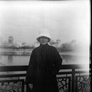 Portrait of Asian Woman Outdoors in Winter Hat