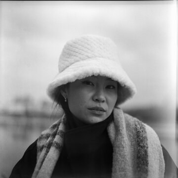 Portrait of Asian Woman Outdoors in Winter Hat