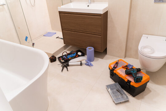 Bathroom Renovation Work in Progress With Tools and Materials