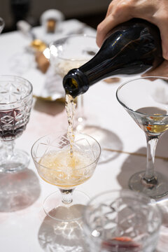 Pouring champagne at party table