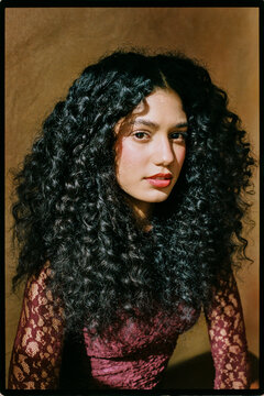 Close up portrait of woman with curly hair