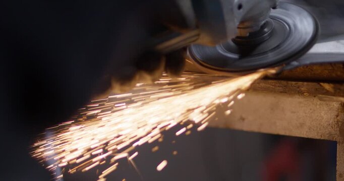 Man Grinding Metal with Plater&oacute;wka Tool