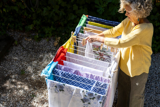 Colorful laundry on drying rack
