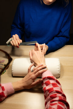 Nail care process at a salon during evening hours