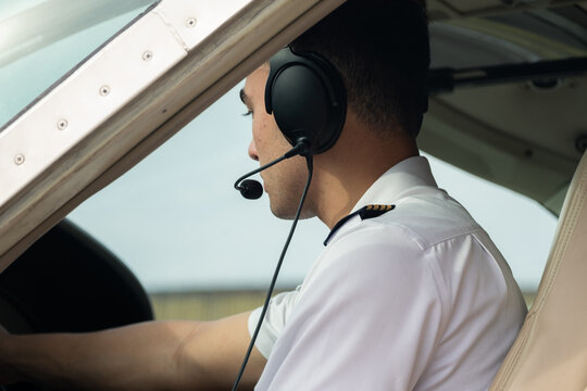 Side profile of pilot in cockpit