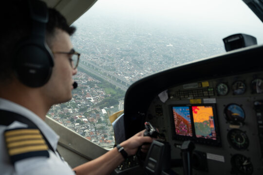 Pilot flying above a densely populated City