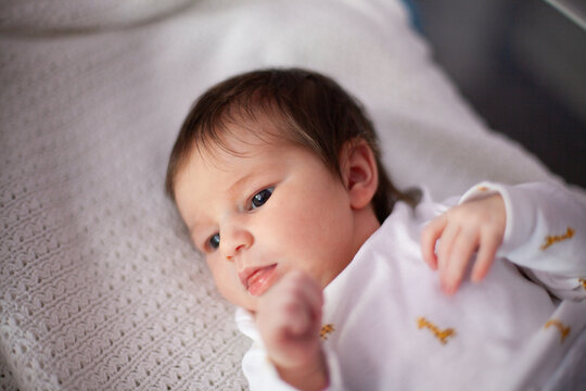 Newborn Baby Lying on Soft Blanket
