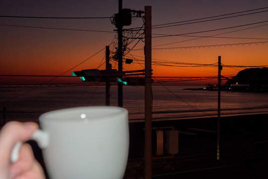 Сup of evening coffee by the sea at a beutiful sunset.