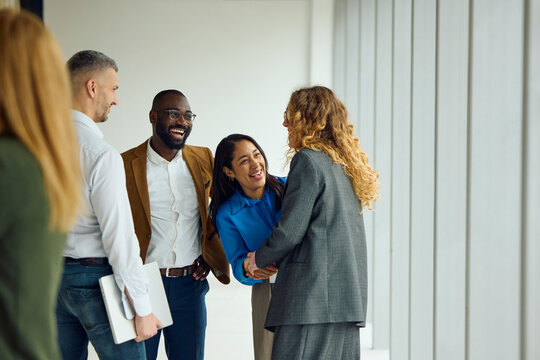 Staff members talking in the hallway