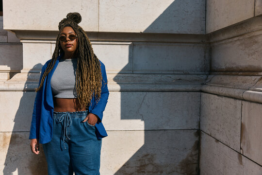 Stylish Woman in Blue Blazer and Sunglasses