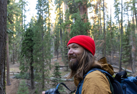Handsome hiker portrait Sequoia Tree grove
