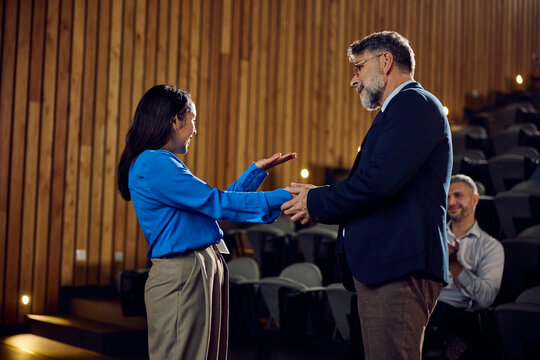 People shaking hands at a conference