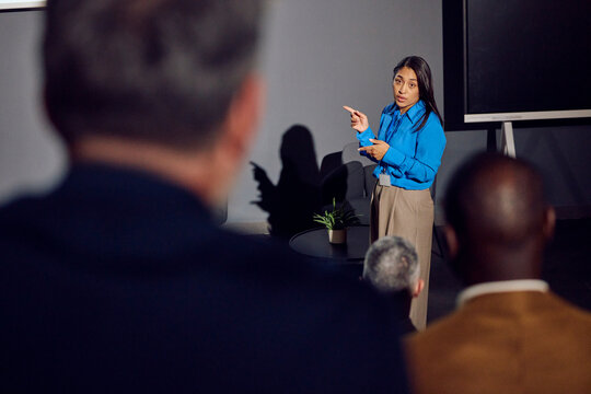 Woman presents at a seminar
