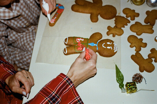 Decorating gingerbread cookies for the holidays  
