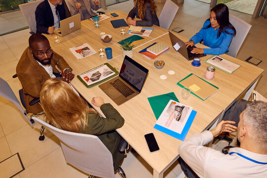 Colleagues work together in a shared office space